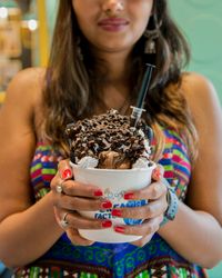 Girl holding a giant ice cream cup
